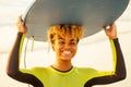 African american girl with surf board on beach going to the water Royalty Free Stock Photo