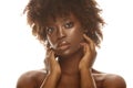 African american girl touching her soft flawless skin on face. Royalty Free Stock Photo