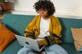 African American girl using laptop at home office typing chatting reading writing email. Young black woman having Royalty Free Stock Photo