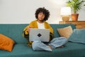 African American girl using laptop at home office typing chatting reading writing email. Young black woman having Royalty Free Stock Photo