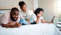 African American girls are not satisfied and sad, sitting in the middle between father and mother. Parents Are using the