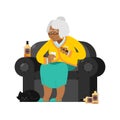 African American Grandmother drinks alcohol Smoke cigar. old woman in an armchair with bottle Whiskey. grandma and cat. Brandy Royalty Free Stock Photo