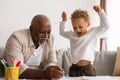 African American Grandpa And Grandson Sketching Together At Home Royalty Free Stock Photo