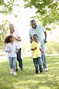 African American Grandparents With Grandchildren Walking In Park Royalty Free Stock Photo