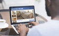 African american guy booking hotel while drinking coffee at cafe