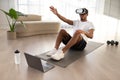 African american guy doing vurtual workout at home Royalty Free Stock Photo