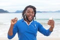 African american guy with dreadlocks dancing at beach Royalty Free Stock Photo