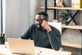 African-American guy with headset using laptop Royalty Free Stock Photo