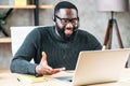 African-American guy with headset using laptop Royalty Free Stock Photo