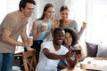 African american guy making selfie with happy friends. Royalty Free Stock Photo