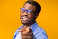 African American Guy Pointing Finger Posing, Studio Shot, Selective Focus Royalty Free Stock Photo