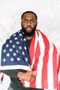 African-American guy stands with US flag Royalty Free Stock Photo