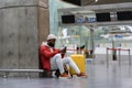 African American guy waiting for departure at airport while using cellphone chatting in social media Royalty Free Stock Photo