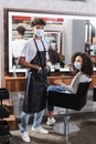 African american hairdresser in medical mask