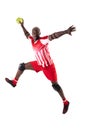 African american handball player jumping while throwing ball against white background Royalty Free Stock Photo