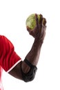 African american handball player wearing elbow guard holding green ball against white background Royalty Free Stock Photo