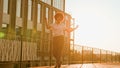 African American happy carefree joyful businesswoman dancing walking in city sun sunshine ethnic cheerful girl female Royalty Free Stock Photo