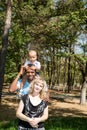 African American happy family: black father, mom and baby boy on nature Royalty Free Stock Photo