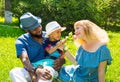 African American happy family: black father, mom and baby boy on nature. Royalty Free Stock Photo