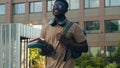 African American happy smiling student guy ethnic university man male with backpack school bag and books smile walking Royalty Free Stock Photo