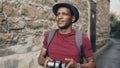 African happy tourist taking photo on his dslr camera. Young man travelling in Europe Royalty Free Stock Photo