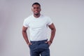 African American healthy male model in a cotton white t-shirt in studio summer lifestyle Royalty Free Stock Photo
