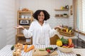 African American housewife is showing variety of organic vegetables to prepare simple and easy cajun southern style salad meal