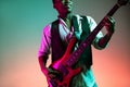 African American jazz musician playing bass guitar. Royalty Free Stock Photo