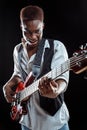 African American jazz musician playing bass guitar. Royalty Free Stock Photo