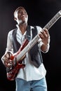 African American jazz musician playing bass guitar. Royalty Free Stock Photo