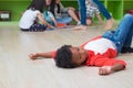 African American kid with loneliness emotion separate from group