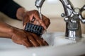 African American Lady washing her hands Royalty Free Stock Photo