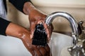 African American Lady washing her hands Royalty Free Stock Photo