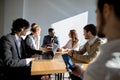 Business people listening to marketing professional african speaker presentation Royalty Free Stock Photo