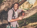 African american listens music in a park