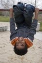 African American little boy on a slide. Royalty Free Stock Photo