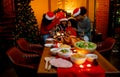 African American little girl give gift box to her father and the other member in family join to celebrate together during