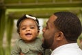 African American father holding his daughter. Royalty Free Stock Photo