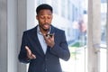 African American male businessman angry talking on mobile phone outside. Business man having phone call outdoors. Nervous mad Royalty Free Stock Photo