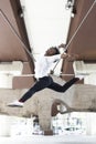 African American male dancer performing acrobatic jump in the city outdoors. Urban dance concept Royalty Free Stock Photo