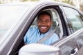 African American male driver looking to camera through car window Royalty Free Stock Photo