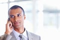 African American male executive on call. Closeup of African American business man on phone call at office. Royalty Free Stock Photo