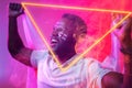 African american male fan with england flag and face paint screaming by illuminated triangle Royalty Free Stock Photo