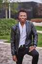 African American male model posing in a park looking at the camera Royalty Free Stock Photo