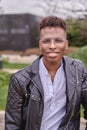 African American male model posing in a park looking at the camera Royalty Free Stock Photo