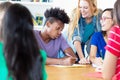 African american male student learning with group of multiethnic students Royalty Free Stock Photo