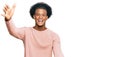 African american man with afro hair wearing casual clothes looking at the camera smiling with open arms for hug Royalty Free Stock Photo