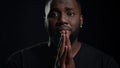 African american man begging indoors. Male person making hand gestures in studio Royalty Free Stock Photo