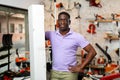 African-american man with box in gardening tools shop Royalty Free Stock Photo