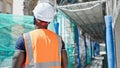 African american man builder standing backwards at construction place Royalty Free Stock Photo